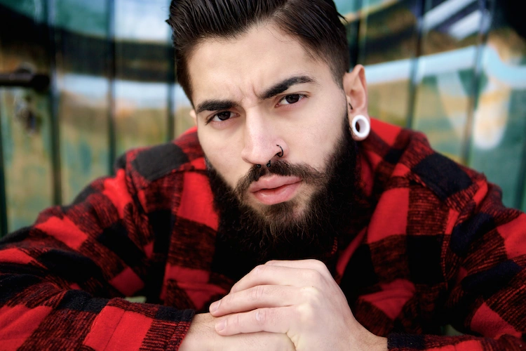 90s mens hairstyle with beard and earrings
