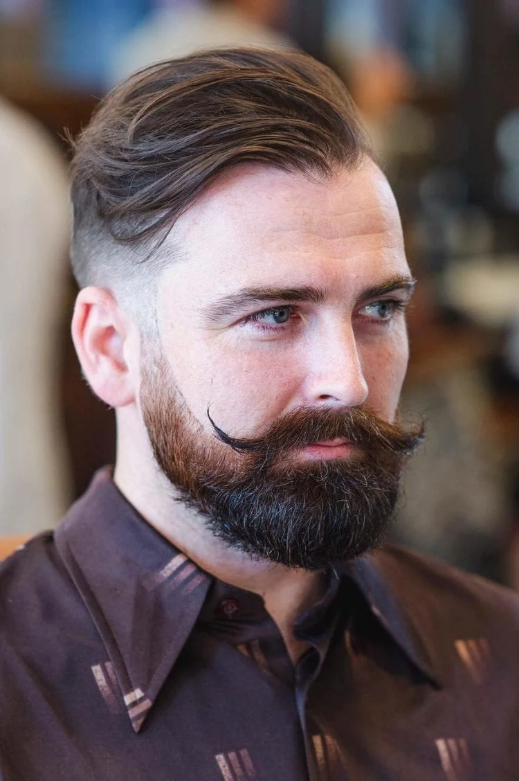Combine a long quiff on the side with mustache modern rock hairstyles