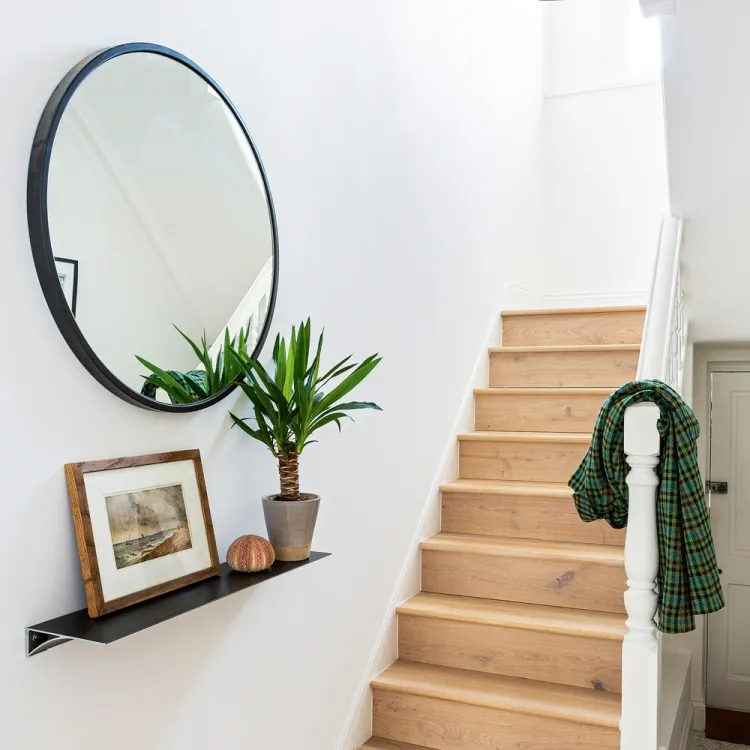 mirror in the hallway makes the space larger