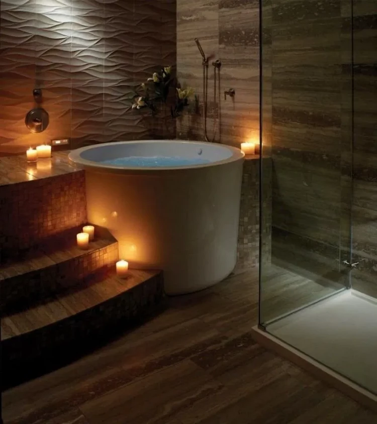 soaking tub and candles in bathroom