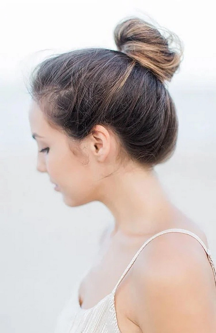 The high bun is a chic way to keep your hair out of your face on hot days