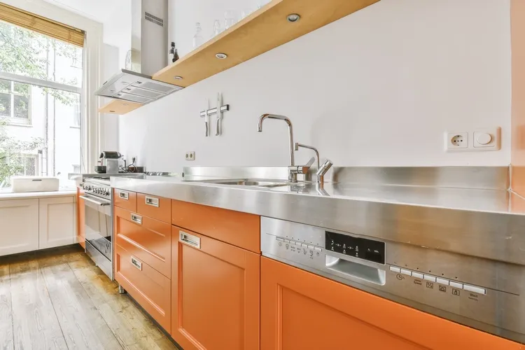 Orange kitchen cabinets Trendy Colourful Interiors