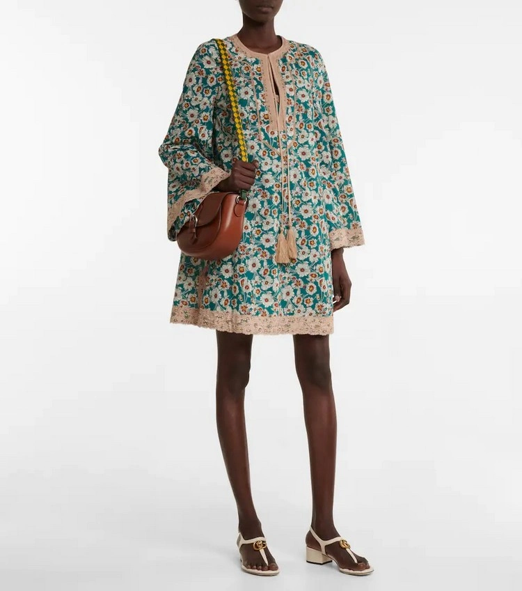 floral cotton mini dress embodies the freedom of travel and escape