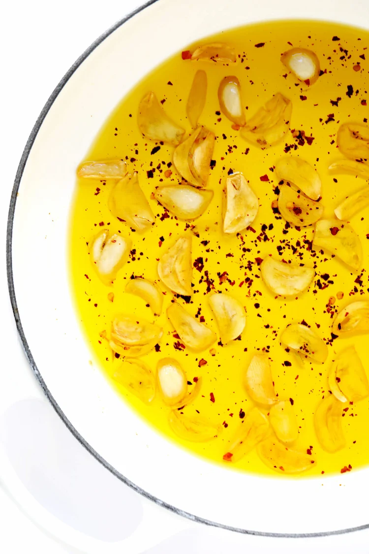 halved garlic cloves for spaghetti aglio e olio recipe