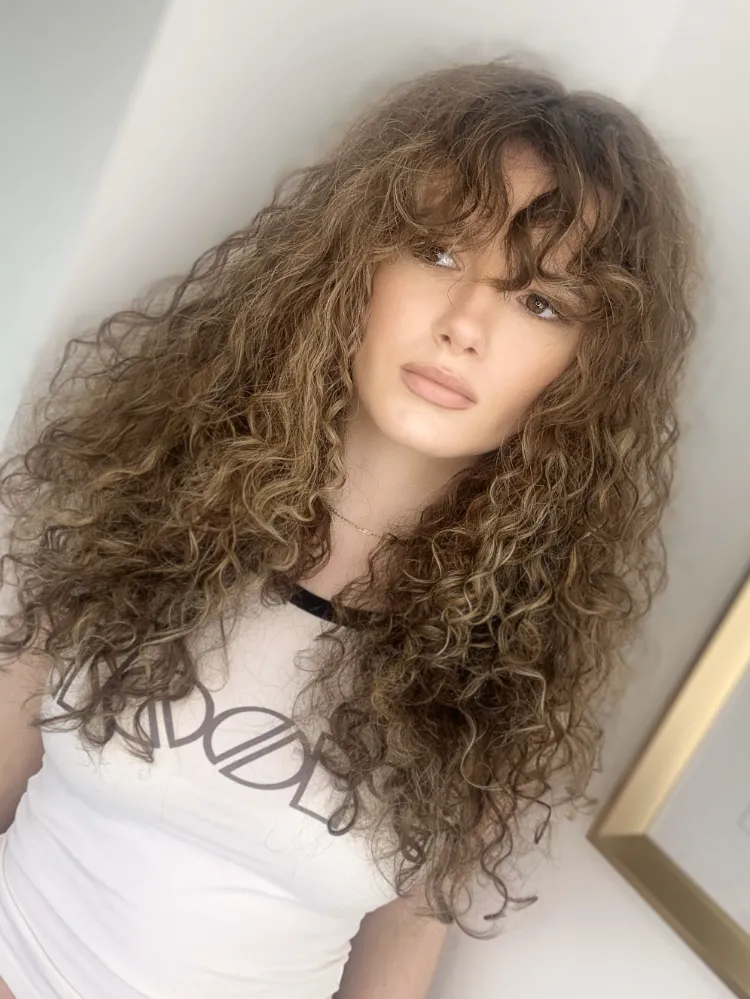 Curly hairstyles for long hair with bangs curly fringe trend 2022