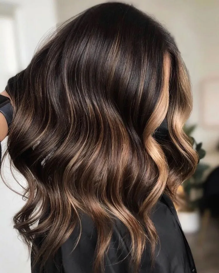 Even the darkest hair tones look beautiful with honey highlights