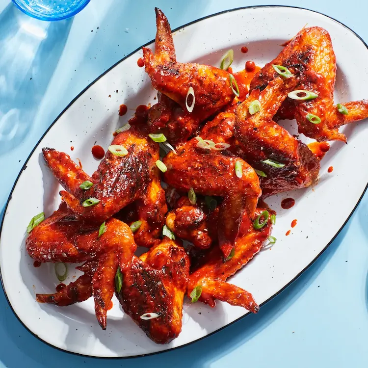 Grilled chicken wings with gochujang and scallions are easy to make