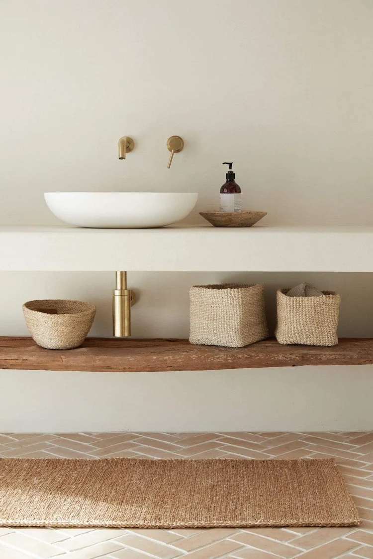 handmade wicker baskets and rug for a mediterranean bathroom