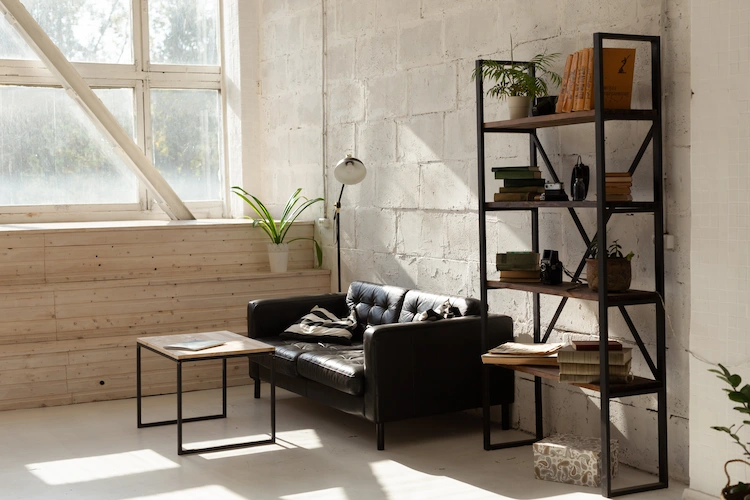 industrial style in the living room with leather sofa and minimalist shelves