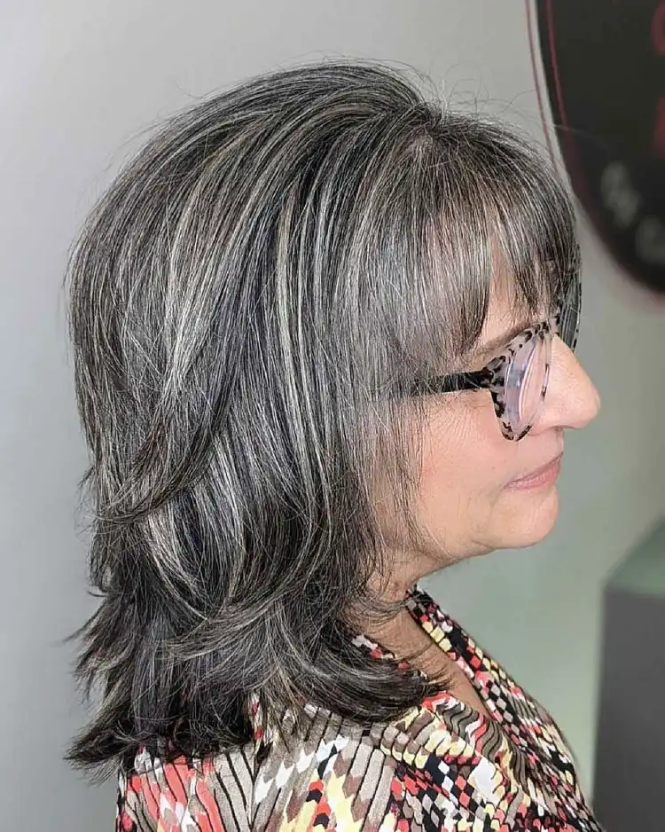 shoulder length hairstyle for women over 50 with bangs