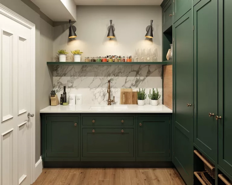 stylishly designed small utility room with sink and cabinets in green