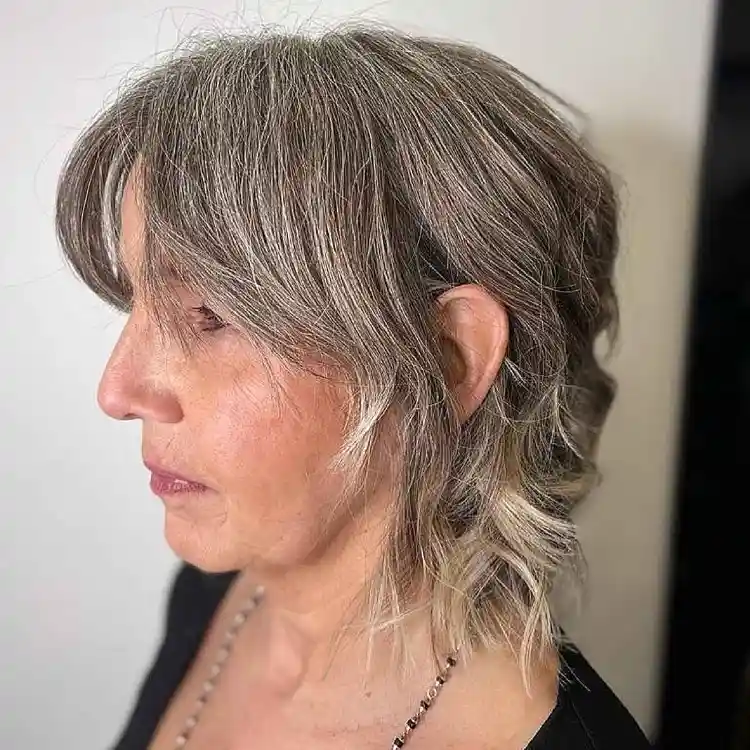 Medium length hairstyles: Layered haircuts with bangs for women over 50  that make you look 10 years younger