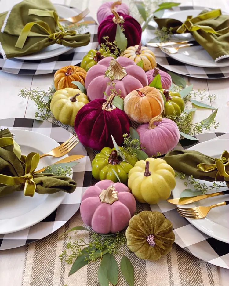 Combine pumpkins made of different materials as table centerpiece