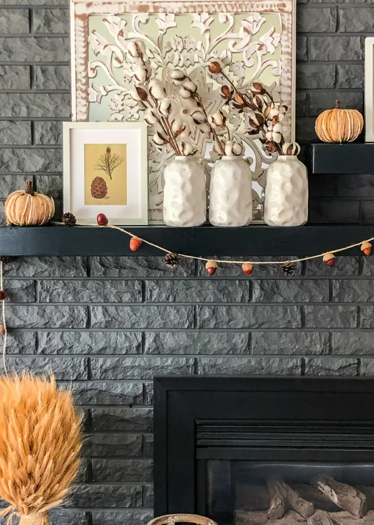 DIY fall garland made of acorns and cones fireplace mantle decor