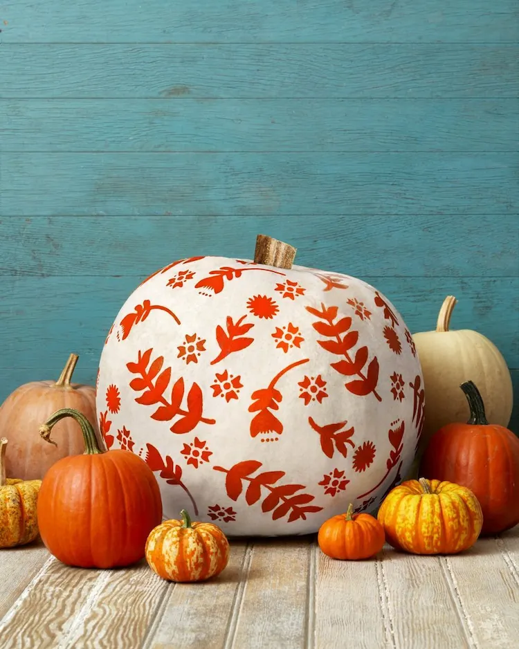 Pick up some leaf and flower stencils stick them onto your pumpkin and add craft paint