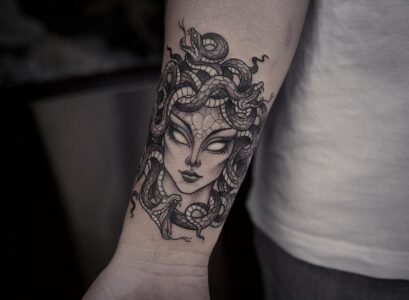 evil-Medusa-tattoo-male-forearm-realistic