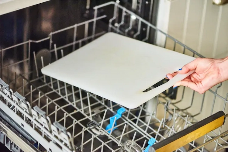 clean plastic cutting boards in the dishwasher