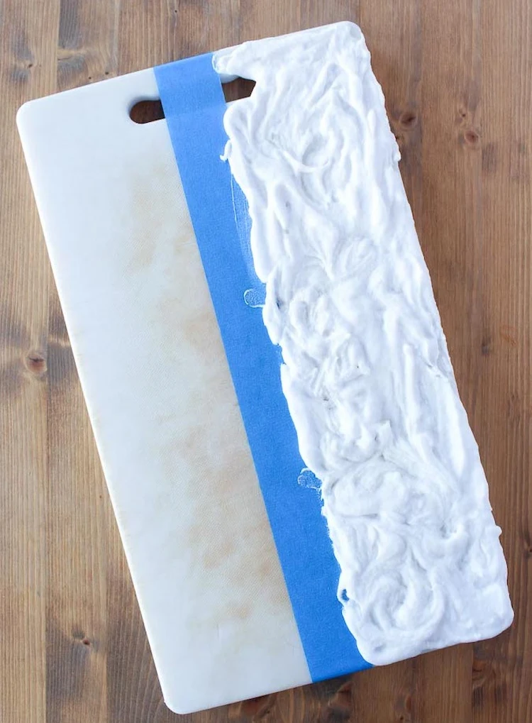 use a paste of baking soda and vinegar to clean plastic chopping boards