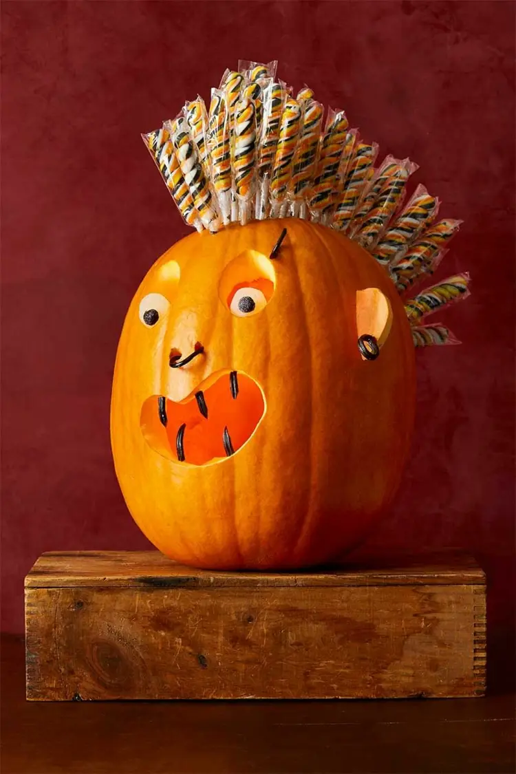 DIY punk style pumpkin with lollipops and piercing