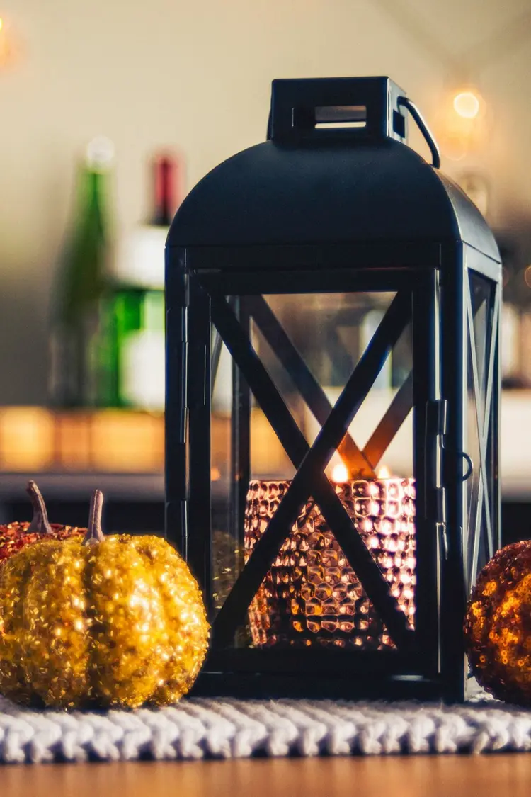 Decorate a lantern for fall copper and glittering pumpkins