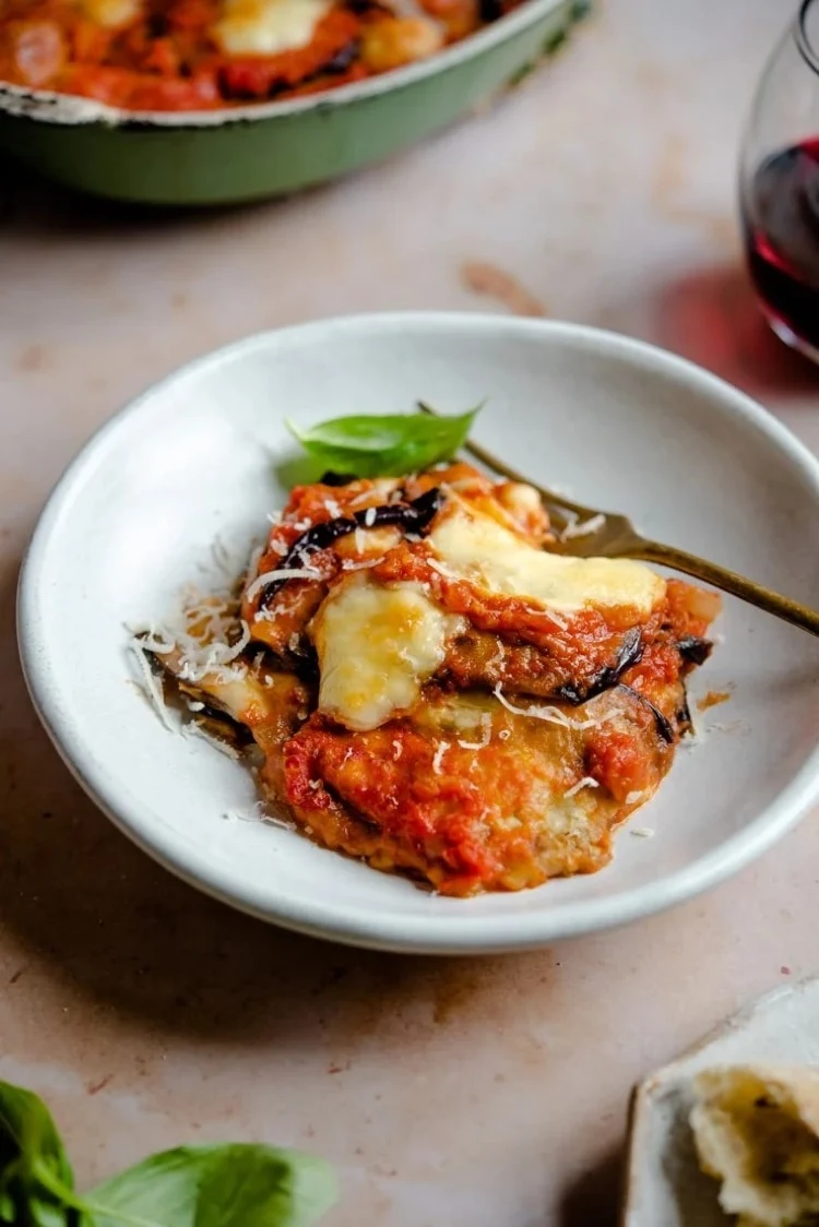Eggplant casserole original Italian recipe served with basil