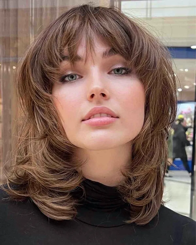 Face framing layered cut for shoulder length hair with bangs