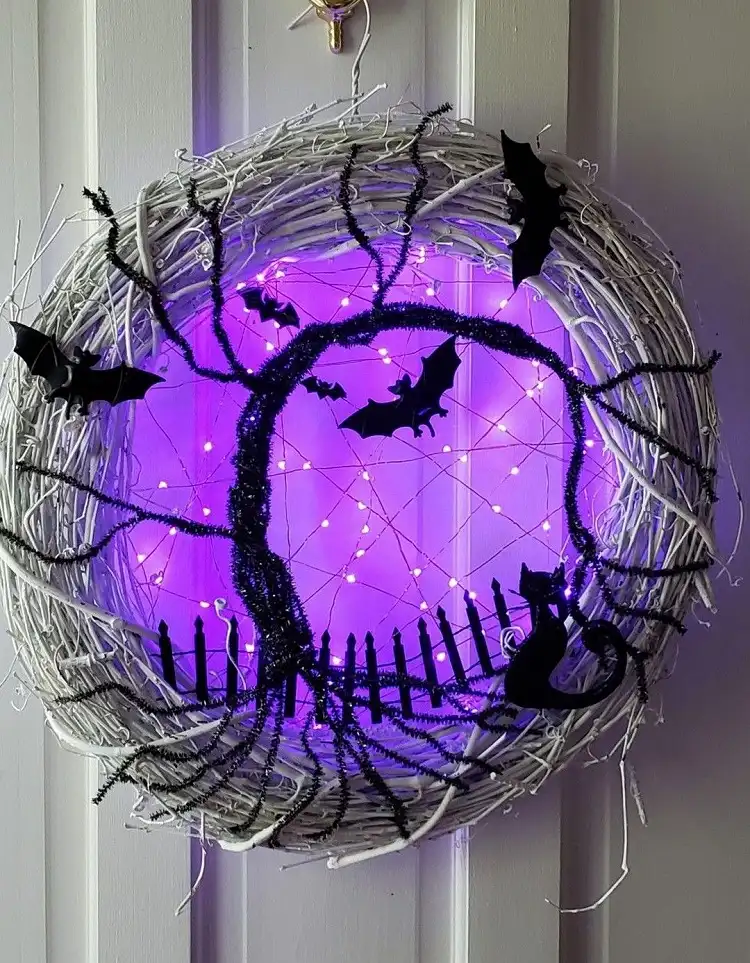 outdoor halloween decoration with lights and bats purple