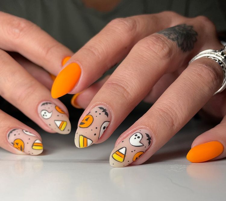 halloween nail decor in orange and yellow