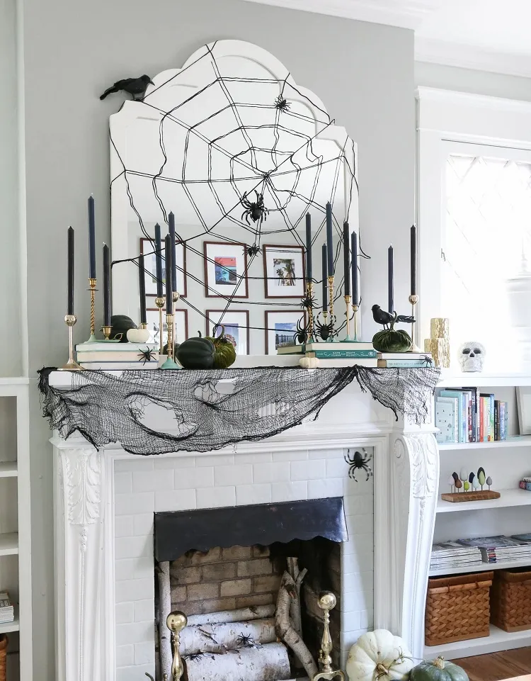 stylish halloween mantel decor, cobweb mantel decor