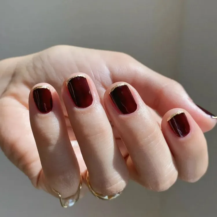 winter 2022 manicure trends burgundy french manicure