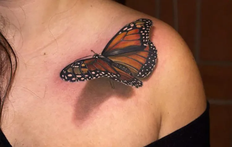 3d butterfly tattoo in black and orange color small realistic tattoo