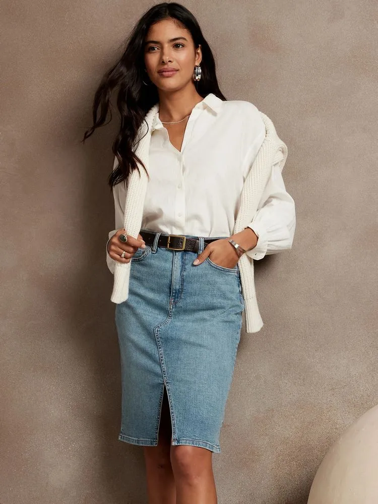 An office look shirt and denim skirt