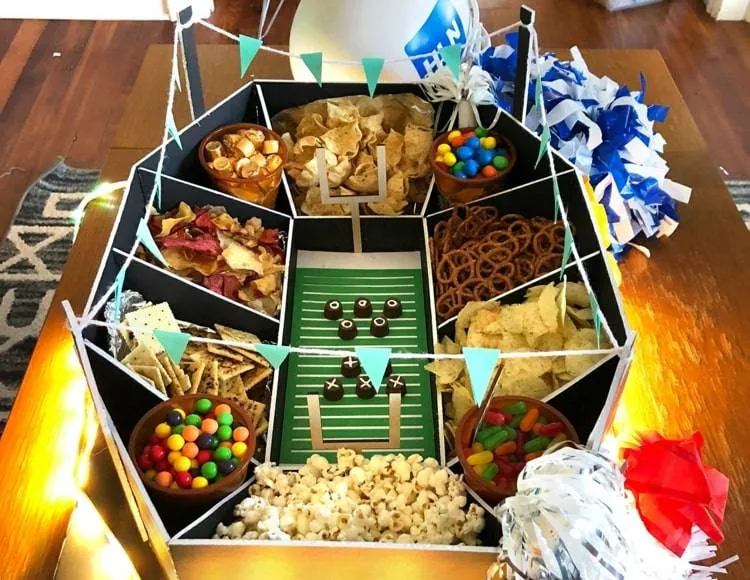 Assemble a creative snack football stadium