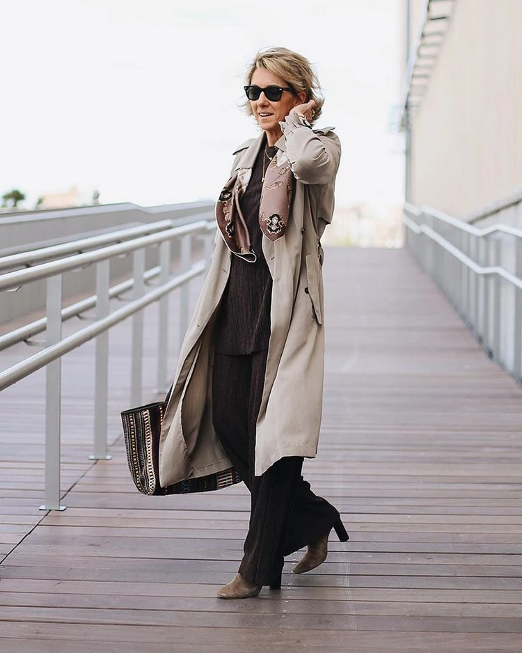 Chic fall outfits for 60 year olds with a trench coat