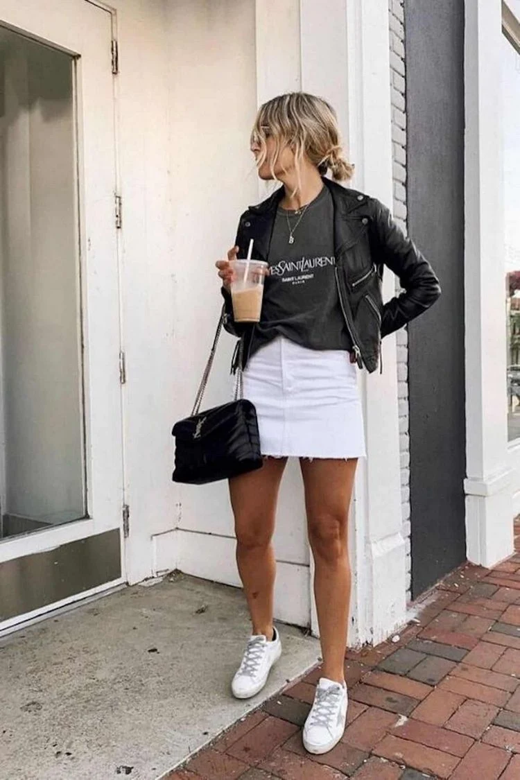 Chic white denim skirt in fall and winter with black leather jacket sneakers