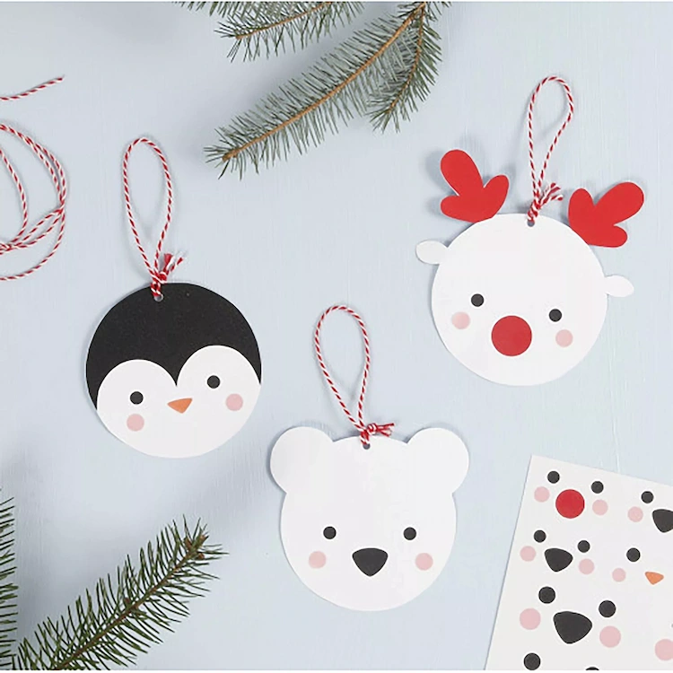 DIY Christmas tree ornaments with children polar animals out of cardboard