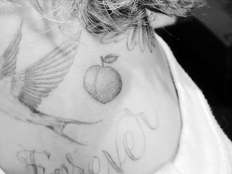 Justin Hailey Bieber tattoos identical peaches symbolic couple