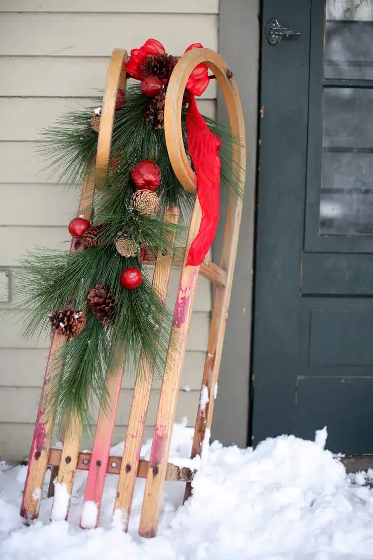 Sleigh decorated for Christmas with ribbon fir branches