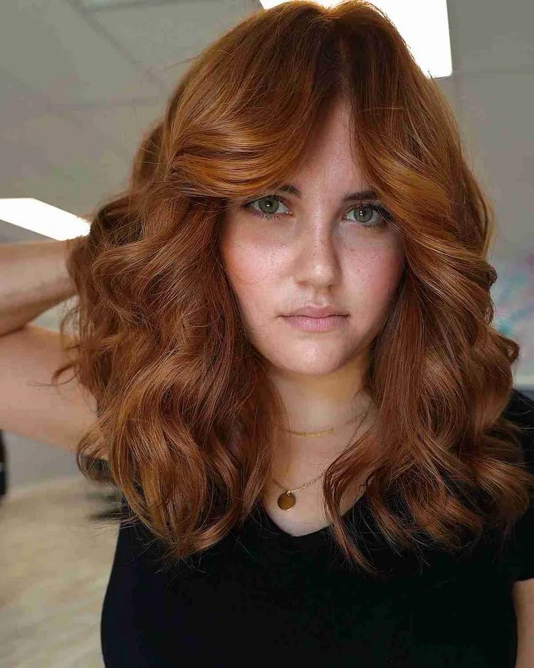 Wavy hair with bardot bangs for ladies with long faces
