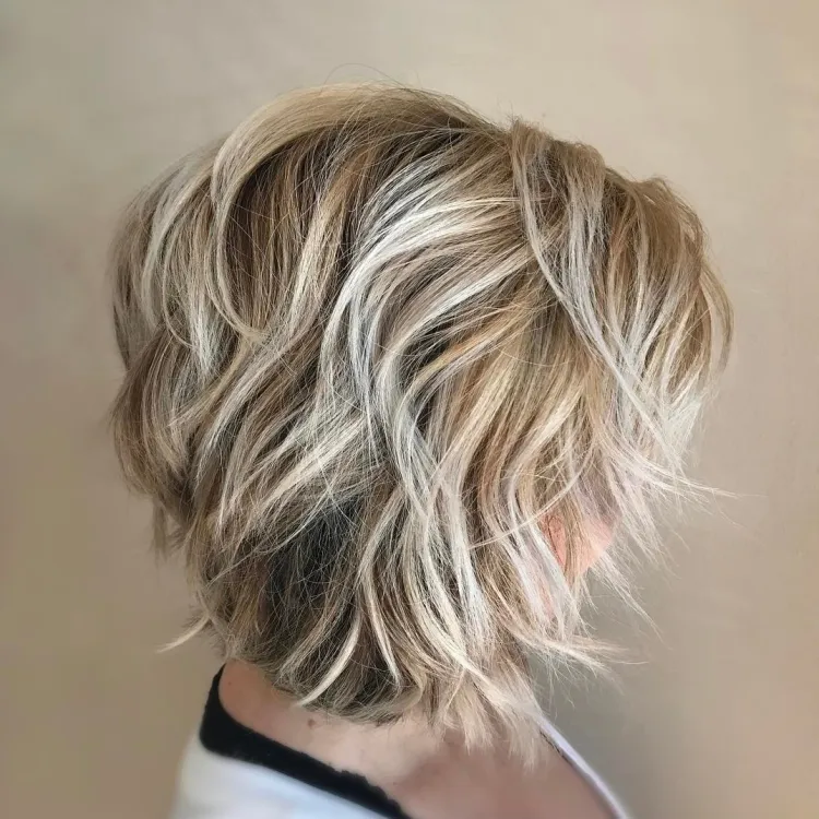a-line bob short hair blonde balayage technique messy look