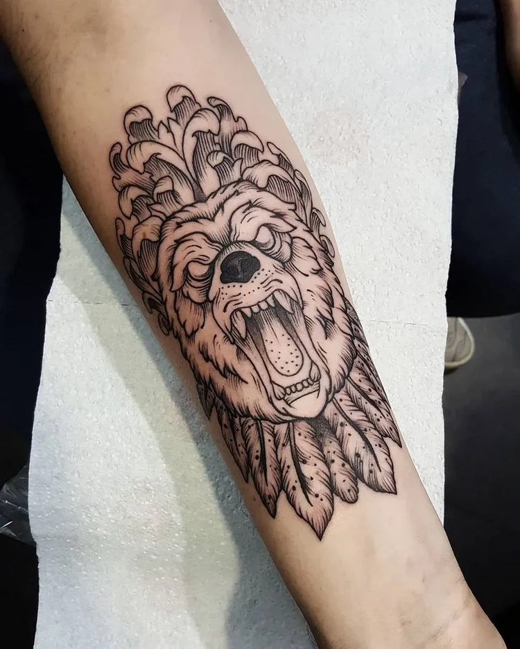 bear head tattoo forearm man