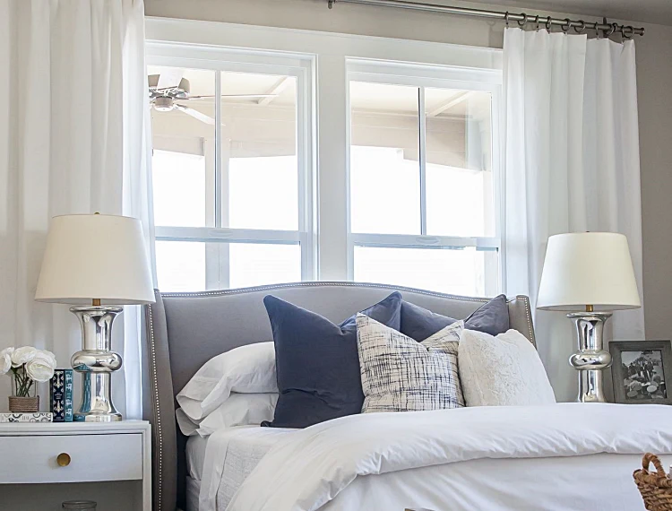 blocking windows lack of natural light furniture arranging mistakes bed in front of a window