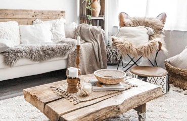 boho chic rustic living room wooden table palette back of a coach rugs cushions blankets