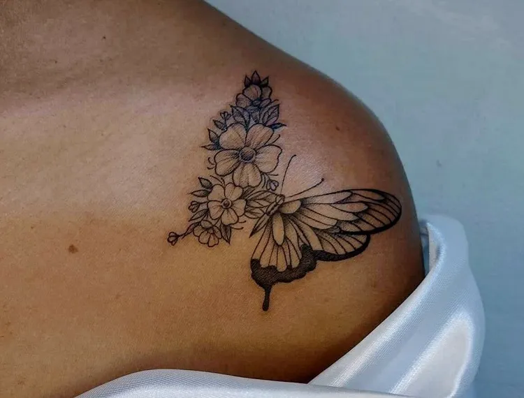 Butterfly shoulder tattoo black girl