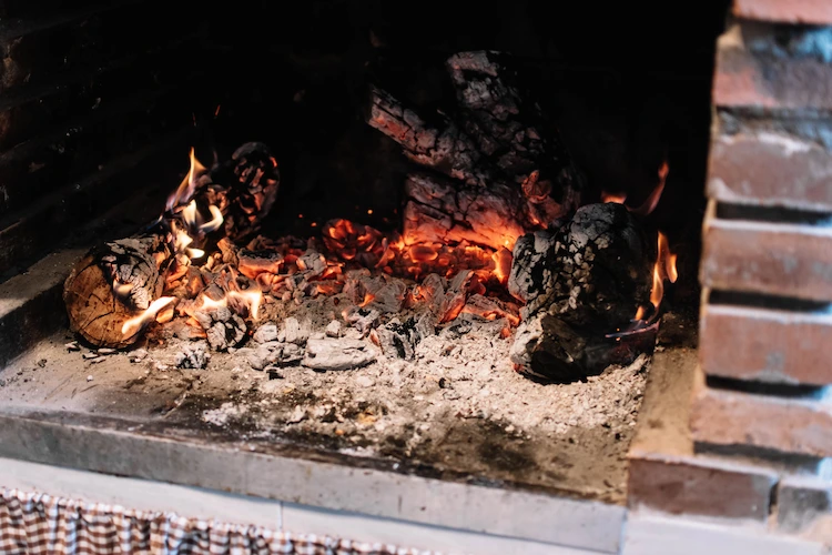 carefully remove hot embers and coal ash from the fireplace and prevent poisoning by carbon monoxide
