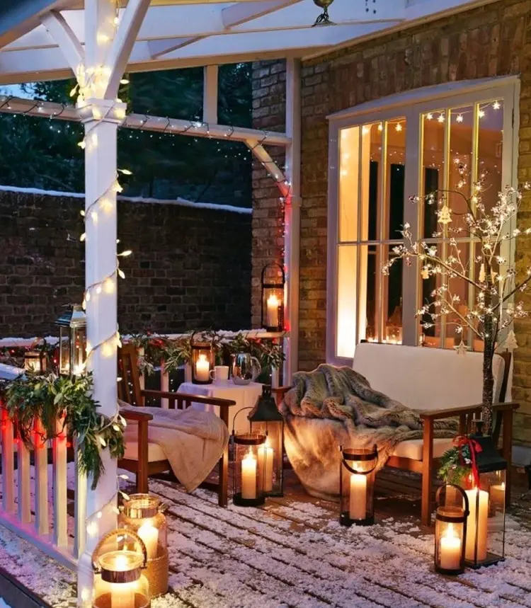 cozy blankets and lights on veranda cozy night christmas decorations 2022 how to decorate ideas