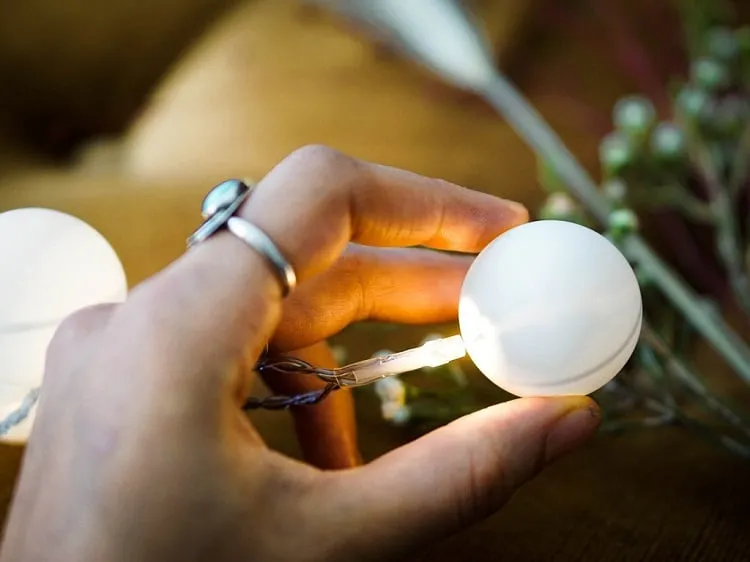 fit lightbulbs into ping pong balls and decorate them