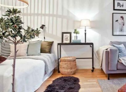 furniture arranging mistakes lack of room zoning bed nightstand grey sofa lamp photo frames cushion