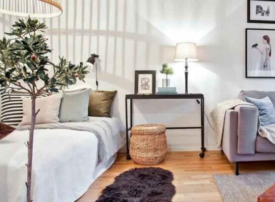 furniture arranging mistakes lack of room zoning bed nightstand grey sofa lamp photo frames cushion