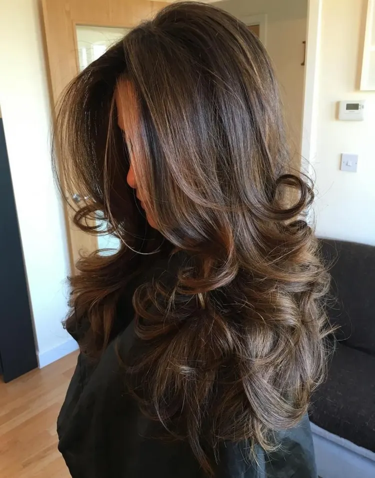 long layered bouncy haircut curled at the ends